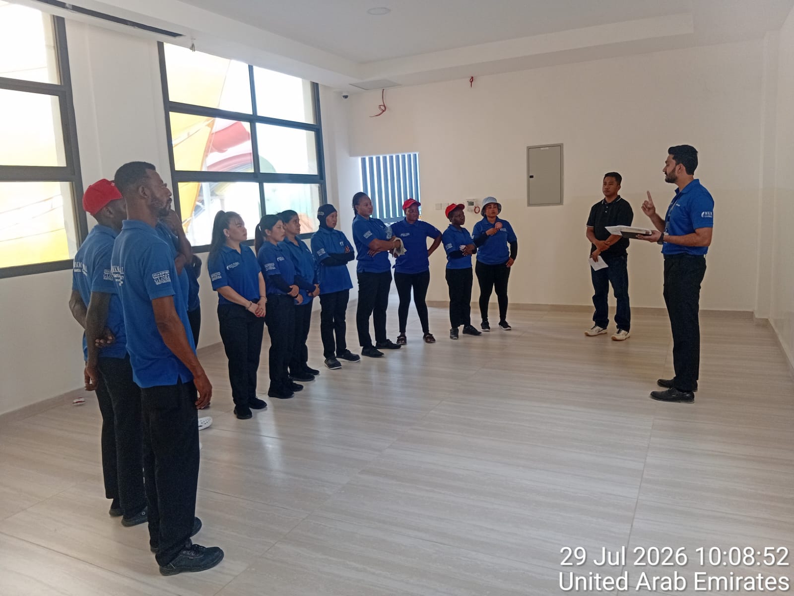 MKM supervisor briefing uniformed cleaning staff in the UAE